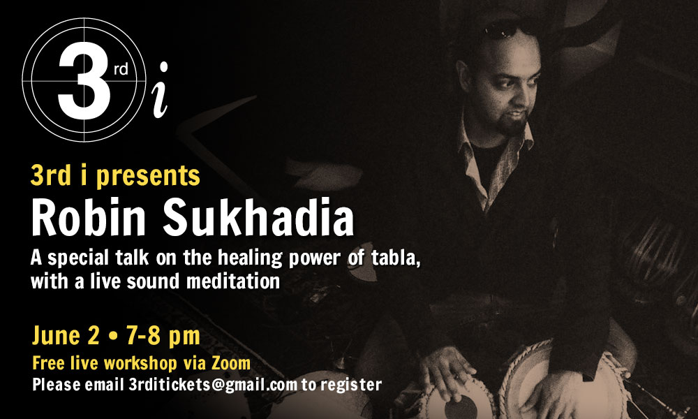 Stylish sepia shot of musician Robin Sukhadia playing a tabla