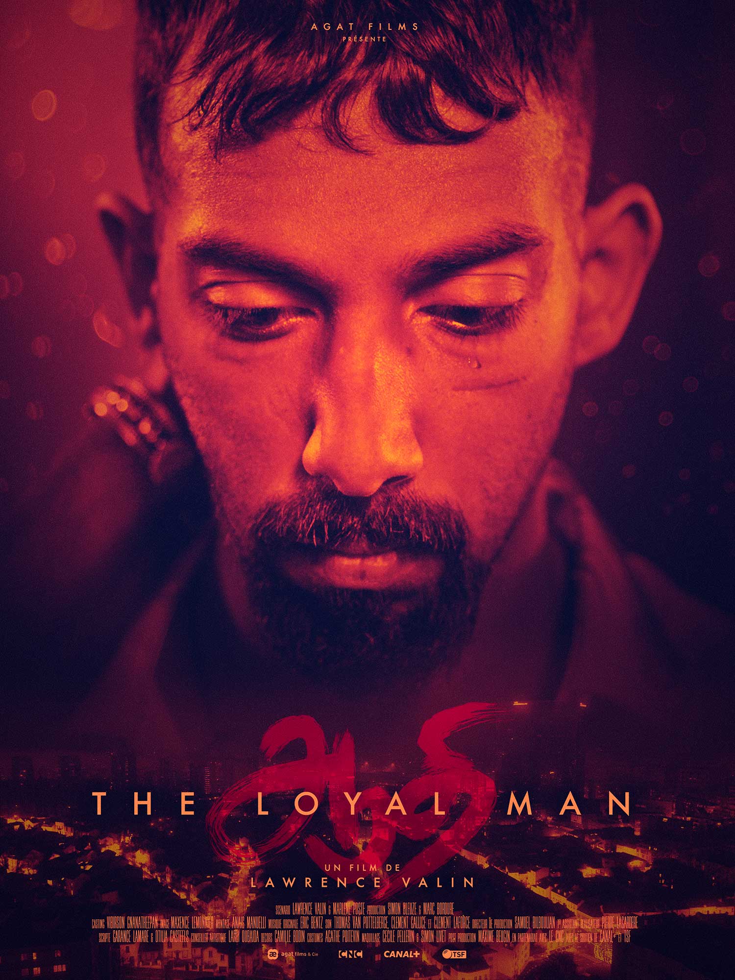 Poster for "The Loyal Man," showing a moody red-tinted photo of the main actor's face