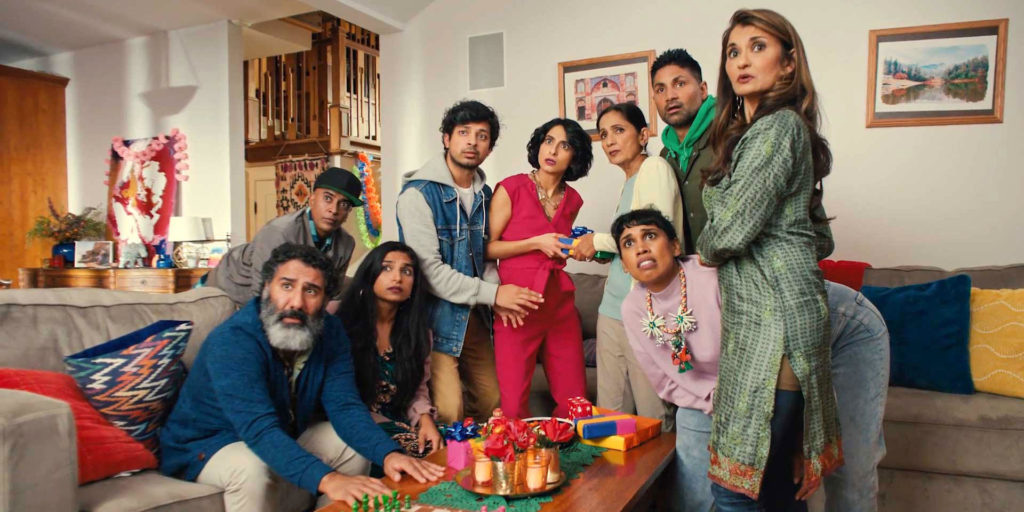 A big family group looks at the camera, perplexed